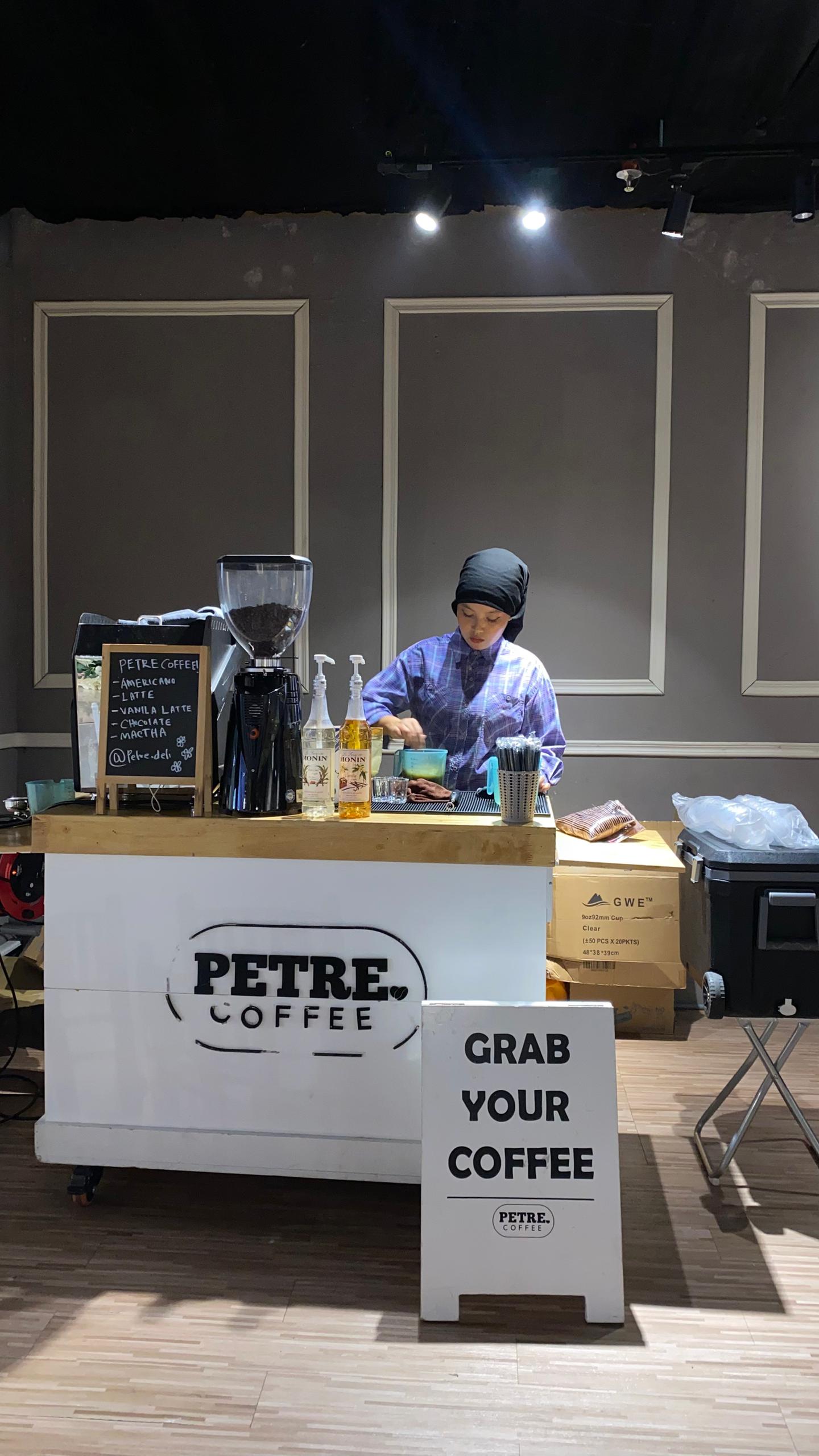 Barista at cart, event backdrop